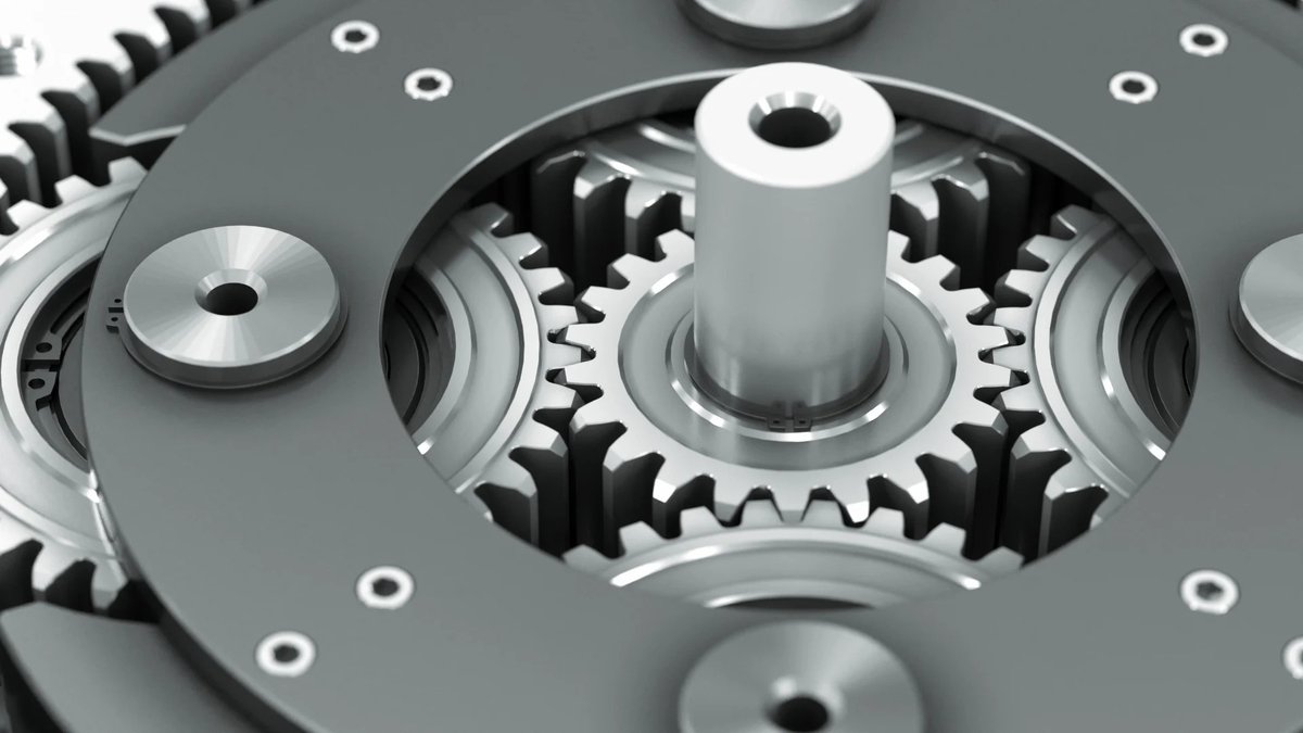 Close-up of a helical gear train during assembly